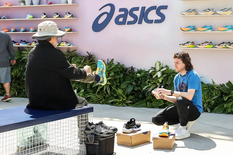 Man trying on ASICS shoes